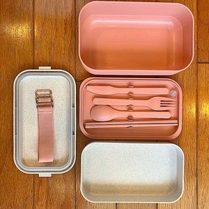 pastel pink and white “Our Place” lunch container.